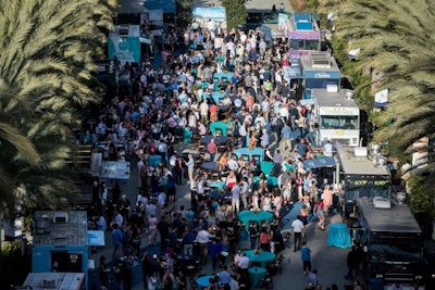 At an opening-night event sponsored by Visit Anaheim, Visit Newport Beach, and Visit Huntington Beach, attendees and their families could try local food trucks.