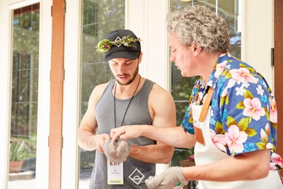 Experiential learning was one of the hallmarks of the conference. Here Daybreaker co-founder Eli Clark-Davis learns how to shuck oysters from the Osyter XO’s Rifko Meier.