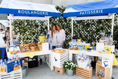 Local vendors included Duc de Lorraine, which sold fresh pastries. Branded blue and white crates were used to showcase products.