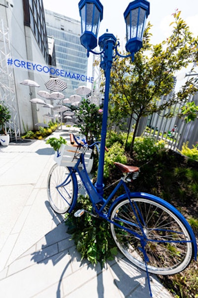 The Montreal pop-up took place June 29 to 30 outside of the Museum of Contemporary Art. The umbrella installation also made an appearance, while additional decor elements included a blue street light and a blue bicycle with a basket that held market products.