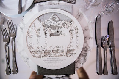 The laser-cut paper menus by TPD Design House featured mountain motifs.