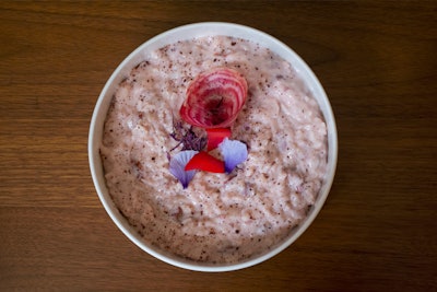 Sweet rosewater rice pudding with candy cane beets, red nasturtium, amaranth, and rose petals, by Drake Catering in Toronto.