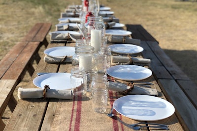 Simple picnic tables were decorated with burlap runners, linen napkins, and candles in Mason jars at the West Bijou Ranch, where Savory Institute hosted a bison tour and an intimate dinner to discuss regenerative agriculture. After sunset, guests went planet- and star-gazing in the open field.