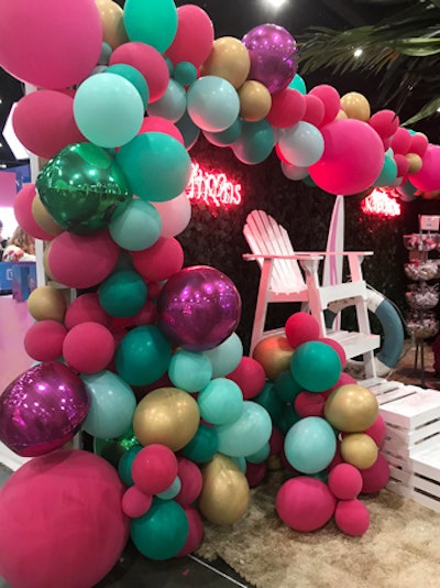 Many guests walking around Beautycon sported glittery hair and skin, which they got from Beauty Creations' in-booth Glitter Bar. The booth also featured a photo area with colorful balloons and a lifeguard stand.