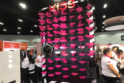 Kiss Cosmetics had a simple but on-theme backdrop for photos, featuring hanging paper lips.