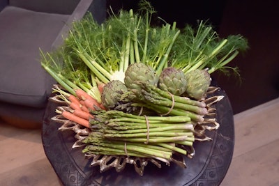 Bunches of asparagus, artichoke, carrots, and more formed centerpieces on the tables. “When the vegetables are abundantly displayed, not only does the design stand out more, it looks much better overall,” noted James.