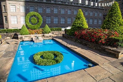 At the Adam Lippes for Target preview event, held in August 2015 in New York, David Stark Design & Production brought the designer's buffalo plaid-inspired collection to life with a fall-inspired event. Two Target bulls-eye topiaries decorated the pool area, creating a fun—and effective—photo op.