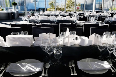 To celebrate the public opening of the Broad in Los Angeles in September 2015, event producer Ben Bourgeois was inspired by the art museum’s unique design. Laser-cut paper foldouts as tabletop centerpieces represented the architecture of Grand Avenue and surrounding buildings downtown, including Disney Hall and the new Broad. LED lights illuminated the representations of the buildings so they appeared to glow from within.