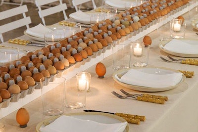 At an October 2016 dinner for Culture Lab Detroit, designer David Stark took inspiration from Belgian artist Koen Vanmechelen's Cosmopolitan Chicken Project, a multimedia examination of chicken breeding. More than 80 dozen eggs in open egg cartons formed a simple but effective centerpiece for the 55-seat table. After the party, the eggs were donated to the Oakland Avenue Urban Farm.