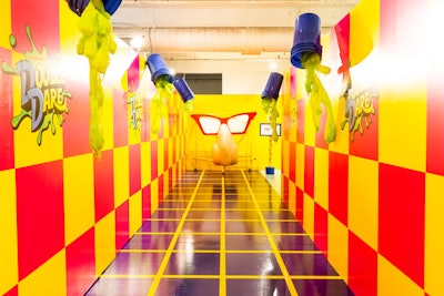 A colorful hallway was inspired by Nickelodeon’s Double Dare—complete with green slime and a giant nose that proved a popular spot for photo ops.
