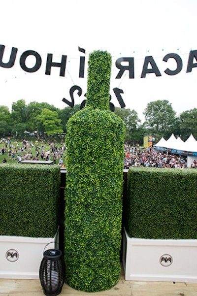 For the Governors Ball music festival in New York in June 2016, Bacardi hosted a house party in a two-story structure on the event grounds. The open-to-the-public space included an upstairs V.I.P. area, where topiary in the shape of a Bacardi bottle offered an eye-catching touch.