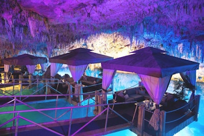 Spa cabanas floating above the water became private cabanas for the #ClubRevolve cave nightclub.