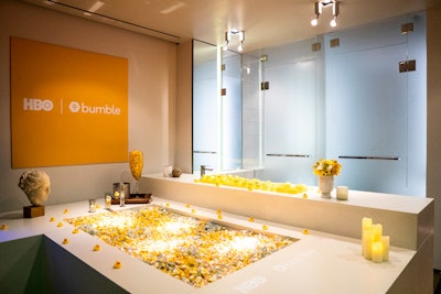 One installation featured a bathtub filled with yellow candy, surrounded by rubber ducks and yellow balls inspired by emojis.
