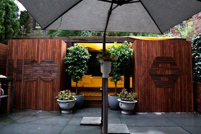 The home's patio featured branding for both companies on the outside of a wooden veranda. The veranda housed a yellow couch where guests could pose for photos and watch Back to the Future.