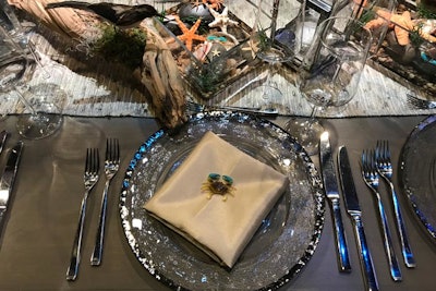 Held in May 2018, the Santa Barbara Museum of Natural History’s Mission Creek Gala was designed by Gillian Valentine with the goal of highlighting four distinct habitats of the California city, including the coastal wetlands. The coastal habitat had an elegant under-the-sea theme, with light, silver tableware and centerpieces of small tide pools filled with starfish, shells, and other ocean-inspired elements.