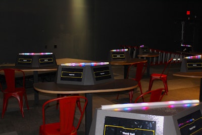 Club 01 is specifically designed for groups, with a stage and seating for 100 people. Guests sit at tables with touch screens, and can be broken into groups for trivia games. The space also hosts wine tastings that use the technology to teach about different ingredients.