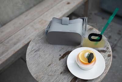 The Fox Sports VR course featured Meyer lemon gelee, creme fraiche, and caviar paired with the 'Ocu-lade' cocktail, which consisted of habanero-infused tequila, mezcal, dried prickly ash, and lime. The cocktail was served in a plastic pouch.