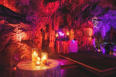 Grotto Bay Beach Resort's cave spa transformed into a nightclub just for #RevolveSummer. Neon signage and chandeliers lit up the cave's walls, while flooring was installed for dancing.
