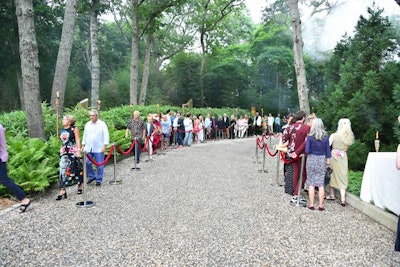 To alleviate the crush of guests lining up on the main road, the Watermill Center created two distinct pathways for guests to enter.