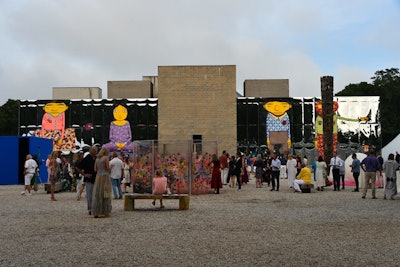 Brazilian graffiti artist duo Osgemeos, who also deejayed the after-party, spray-painted murals called 'Giants' across the backside facade of the Watermill Center.