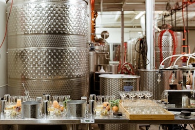 Cocktail stations throughout the distillery allow guests to explore at their own pace.