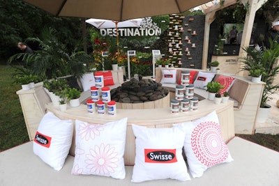 The activation features lounge seating and branded pillows, along with displays of Swisse products.