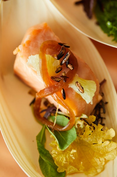 Poached salmon with lime soya onions, puffed wild rice, teeny lettuce, and soft herbs