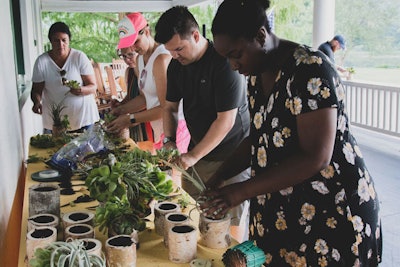 For an evening event, designer Isabella Sikaffy led the group in creating centerpieces using succulents and air plants from her garden in California.