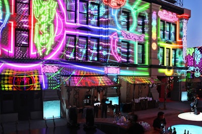 For an event for 1,500 guests of a corporate client, the facades on several backlot streets were mapped with digital images, completely changing the look.