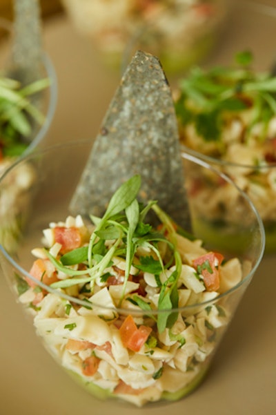 Vegan “ceviche” with lime-marinated cashews, hearts of palm, cucumber, leche de tigre, tiny cilantro, avocado mousse, and crispy blue corn