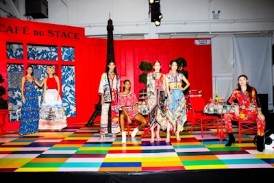 At the fictional Parisian Café du Stace (a nod to the designer), models gathered wearing dresses with handkerchief hems and scarf prints.
