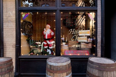 For this event, the event designers created custom storefront window displays to go with the holiday theme on Hennesy Street.