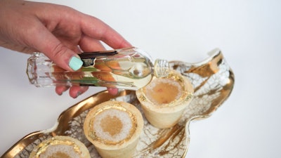 Floating on a Cloud: 24K Rose Gold Cookie Cups with champagne, a touch of St. Germaine, topped with cotton candy!