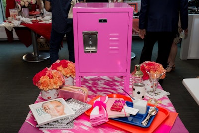 Hunter Douglas and Patrick James Hamilton Designs created the display inspired by the Tony-nominated Mean Girls. The design featured a mini hot pink school locker, with items including a four-piece martini set from Tuscany Classics, Kate Spade cocktail shakers, and four pink and orange ombre placemats. Ramy Cosmetics provided cosmetics and makeup and brow-shaping gift certificates. The locker also included gift certificates to see the show and eat at Cafeteria in New York.