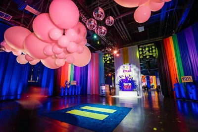 Guests were greeted with rainbow curtains, oversize balloons, disco balls, 'TurnOut' signage, and a carpet emblazoned with the campaign's logo as they entered the gala. The welcome room became a popular spot for guest photo ops.