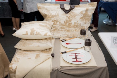 Home accessories and interior designer Peter Valcarcel created a display inspired by South Pacific, which had items including a tote bag, a throw, two pillows with down feather inserts, two hand-painted plates, and chopsticks with leather-wrapped ends.