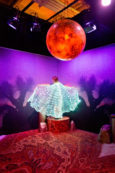 Inspired by the California night sky and the 1970s, Nicole Richie’s space boasted a trippy atmosphere and on-theme cloaks for guests to pose with for photos.