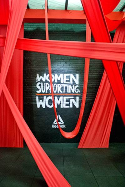 Reebok used its space to promote its PureMove Bra, which reacts to movement via a new responsive fabric. “The Support System” featured a maze of bright red swings that guests could sit on.