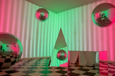 Magenta Field’s “Reality Rendered” is inspired by old-school computer graphics, bringing to life the virtual space through reflective shapes. Magenta Field is a collaboration between Brooklyn-based artists Katherine Brice and Chris Lunney.