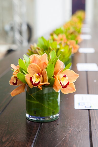 Elegant arrangement with orange orchids