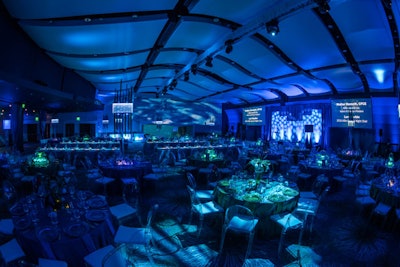 For the Allie Awards in Atlanta in March 2016, themed environments channeled earth, water, and fire. Dinner took place in the water-inspired space which had deep blue lighting and blue rentals designed to make guests feel as though they were submerged in ocean waters. Active Production and Design built a custom stage set for the space.