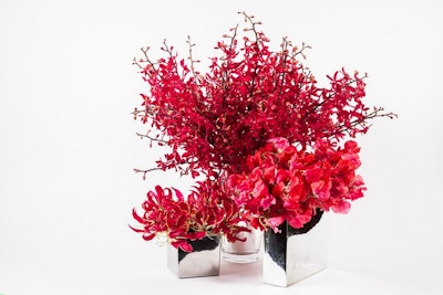 A vibrant selection of red azima orchids, gloriosa, and sweetpeas