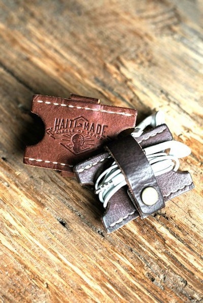 Emboss your logo on this handmade leather cord keeper that fights the child slavery crisis in Haiti