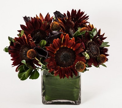 Perfect for fall, an arrangement of brown sunflowers, black calla lilies and echinacea