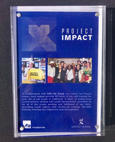 Signage for United Talent Agency explaining the social impact of their global volunteer day shirts