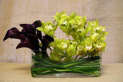 An elegant arrangement of black calla lilies and green cymbidium orchids