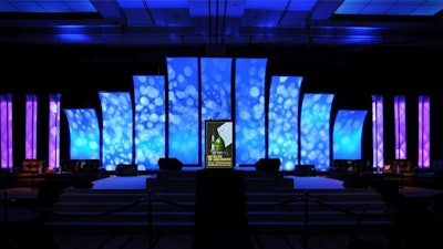 Stage with Cobra Skin Fabric with Textured Uplighting and Backlighting