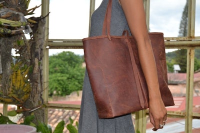 Handmade leather tote bag that provides 13 days of schooling for a child in Honduras