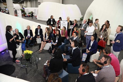 As in the past, many panels were held in igloo-shaped rooms. Headphones allowed guests to hear over the busy show noise.