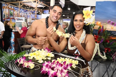 Many booths featured on-theme activities or costumed staffers, such as this booth from Hawaii, which gave out leis.